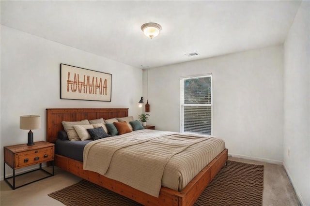 bedroom featuring light colored carpet