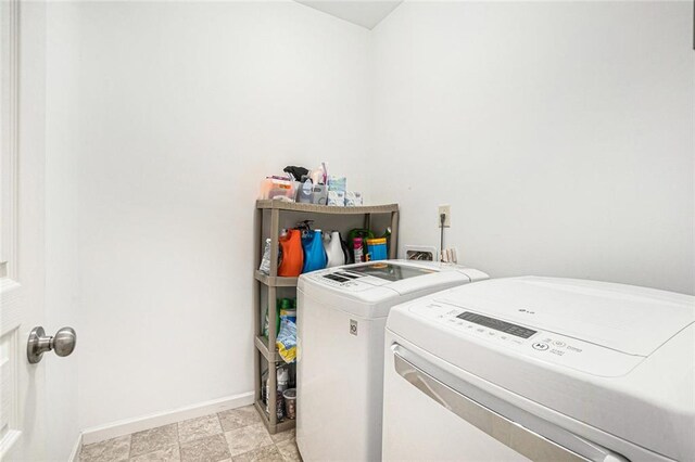 laundry room featuring washing machine and dryer