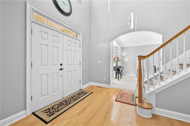 foyer entrance with hardwood / wood-style flooring