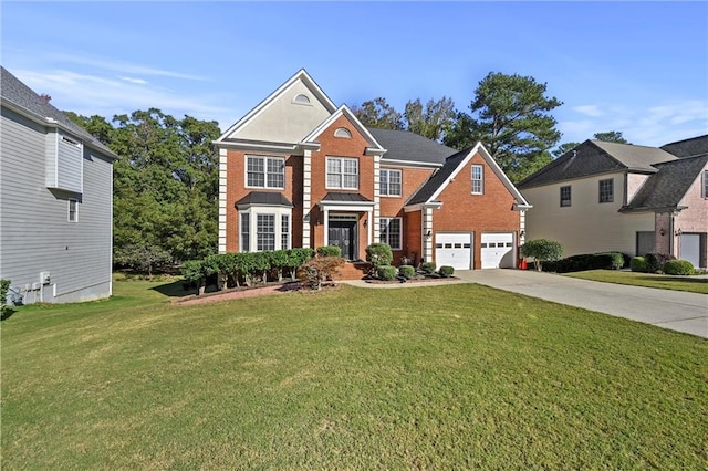 view of front facade with a garage and a front lawn