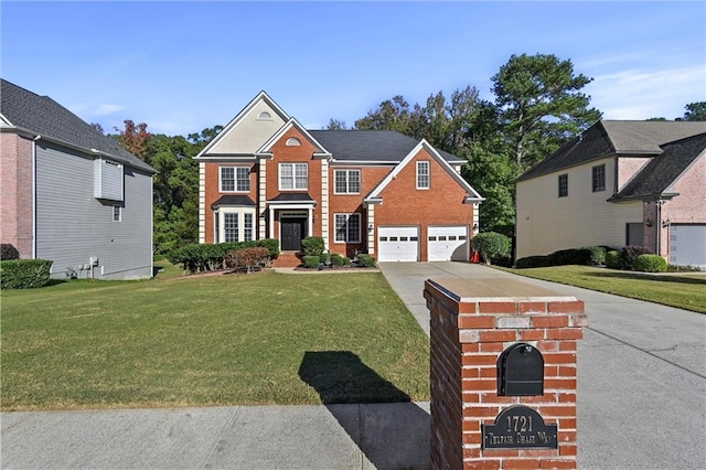 view of front of property featuring a garage and a front yard