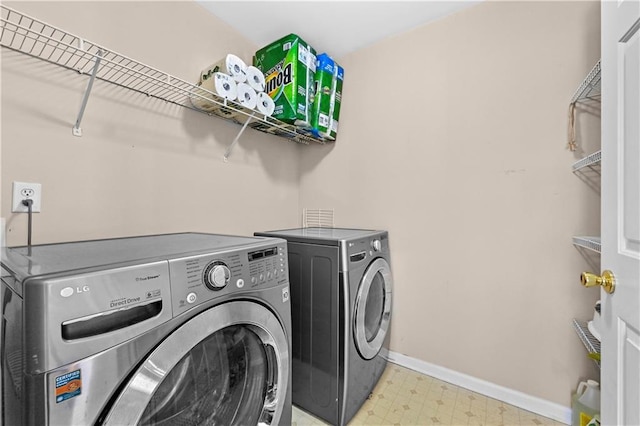 laundry area with washer and clothes dryer