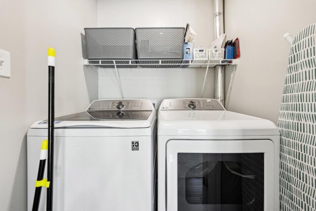 laundry room featuring washing machine and dryer