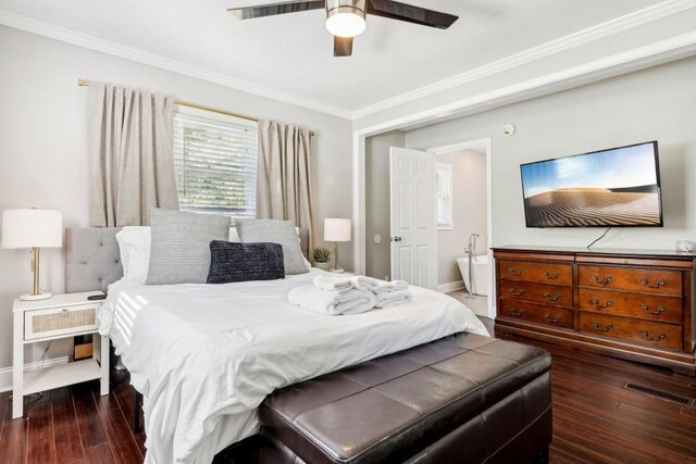 bedroom featuring dark hardwood / wood-style flooring, ornamental molding, and ceiling fan