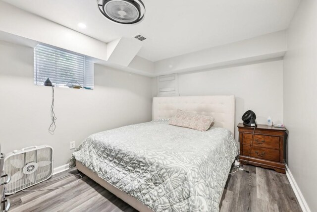 bedroom with wood-type flooring