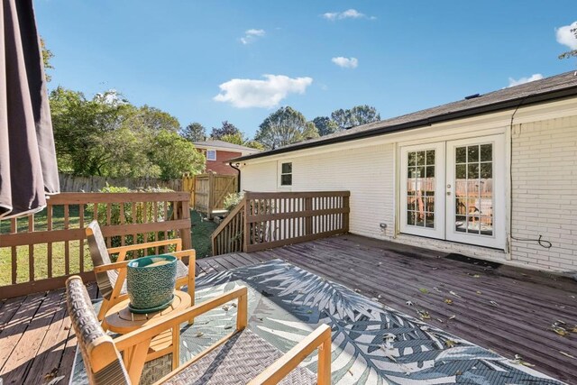 wooden deck featuring french doors