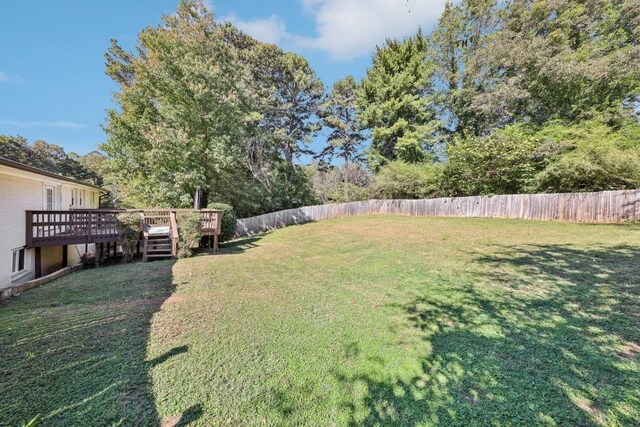 view of yard with a deck