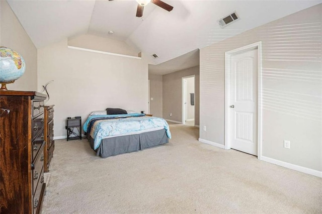 bedroom with ceiling fan, light colored carpet, and vaulted ceiling