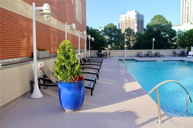 250 Park Ave W Unit 802, Atlanta, GA 30313 - community pool featuring a patio