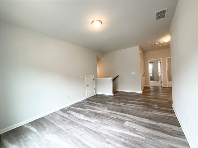 empty room with hardwood / wood-style flooring