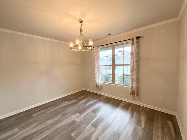 unfurnished room with an inviting chandelier, ornamental molding, and dark hardwood / wood-style flooring