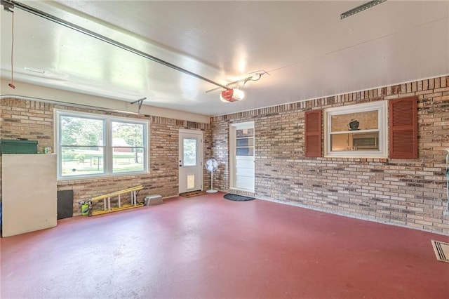 7234 Post Rd, Winston, GA 30187 - interior space with brick wall, concrete floors, and a garage