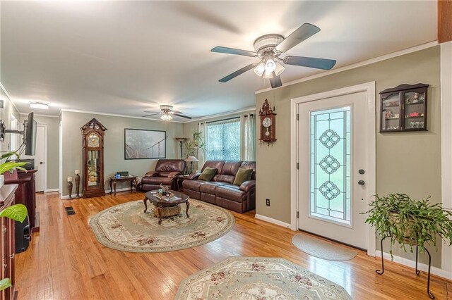 7234 Post Rd, Winston, GA 30187 - living area with wood finished floors, a ceiling fan, and crown molding