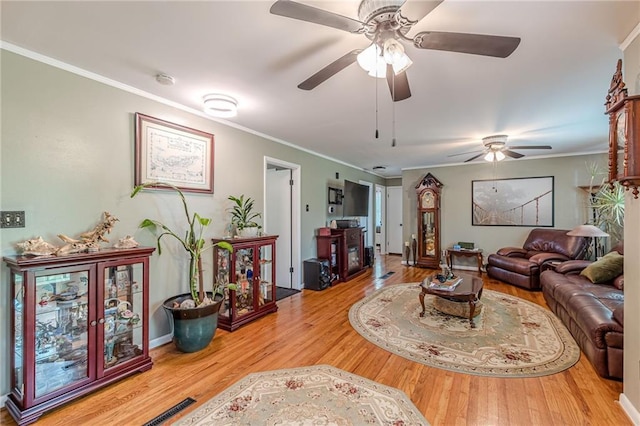 7234 Post Rd, Winston, GA 30187 - living room featuring wood finished floors, a ceiling fan, and ornamental molding