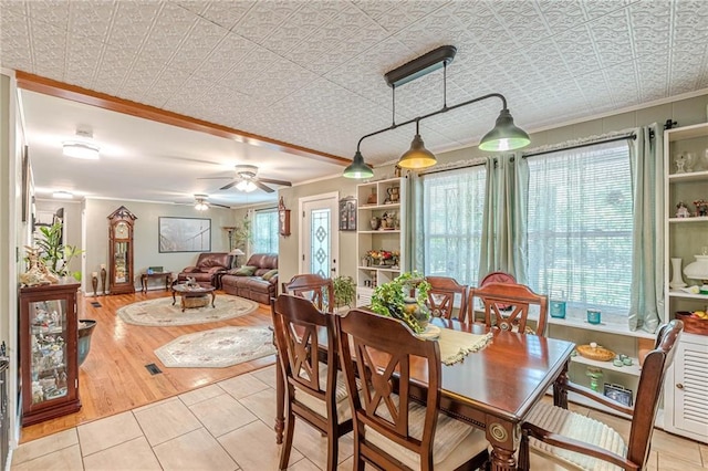 7234 Post Rd, Winston, GA 30187 - dining space with crown molding, an ornate ceiling, ceiling fan, and light tile patterned floors