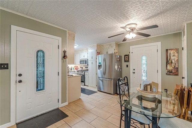 7234 Post Rd, Winston, GA 30187 - entryway with crown molding, a ceiling fan, light tile patterned floors, and an ornate ceiling