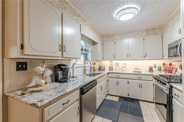7234 Post Rd, Winston, GA 30187 - kitchen featuring appliances with stainless steel finishes, tasteful backsplash, an ornate ceiling, and light stone counters