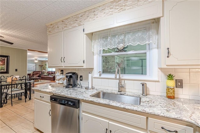 7234 Post Rd, Winston, GA 30187 - kitchen with dishwasher, ceiling fan, backsplash, light tile patterned flooring, and white cabinets