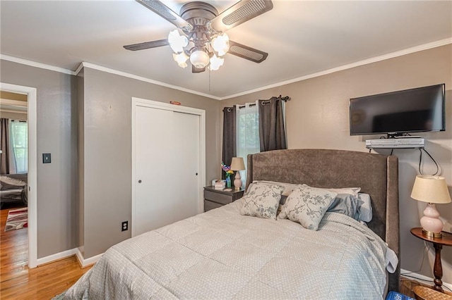7234 Post Rd, Winston, GA 30187 - bedroom with wood finished floors, a closet, ornamental molding, and ceiling fan