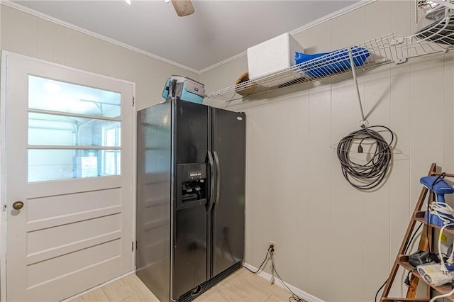 7234 Post Rd, Winston, GA 30187 - kitchen featuring black fridge, ornamental molding, and light wood finished floors
