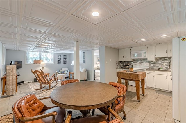 7234 Post Rd, Winston, GA 30187 - dining space with light tile patterned floors, an ornate ceiling, and recessed lighting