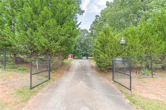7234 Post Rd, Winston, GA 30187 - view of asphalt driveway featuring a gate and a gated entry