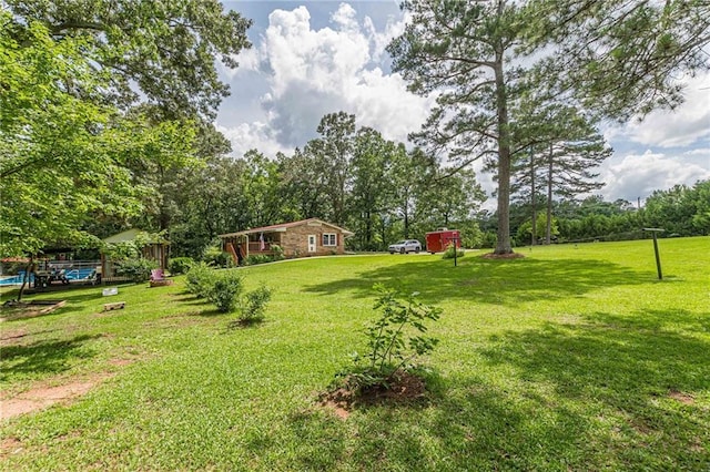7234 Post Rd, Winston, GA 30187 - view of grassy yard featuring view of wooded area