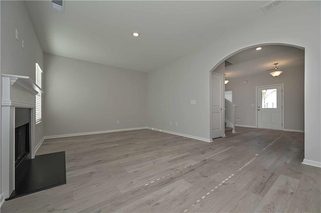 unfurnished living room with light hardwood / wood-style flooring