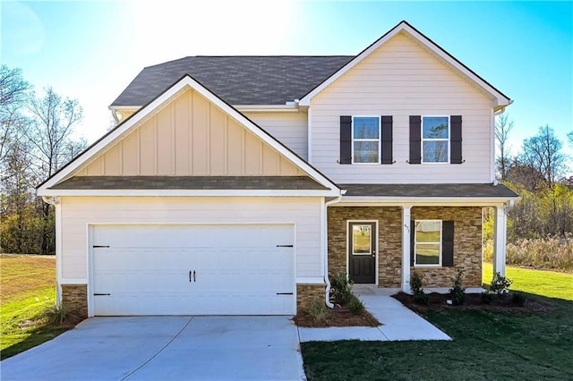 craftsman house with a porch, a garage, and a front lawn