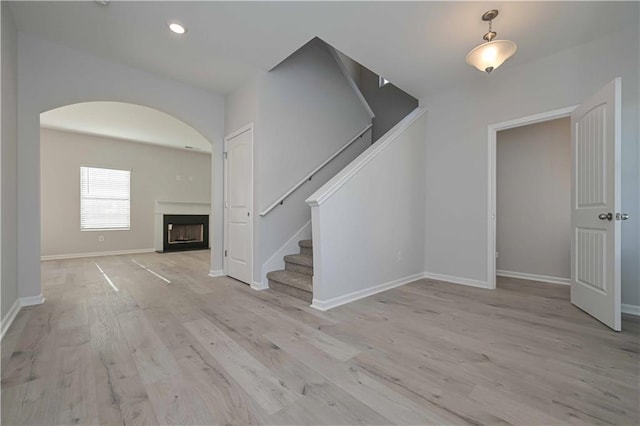 unfurnished living room with light wood-type flooring