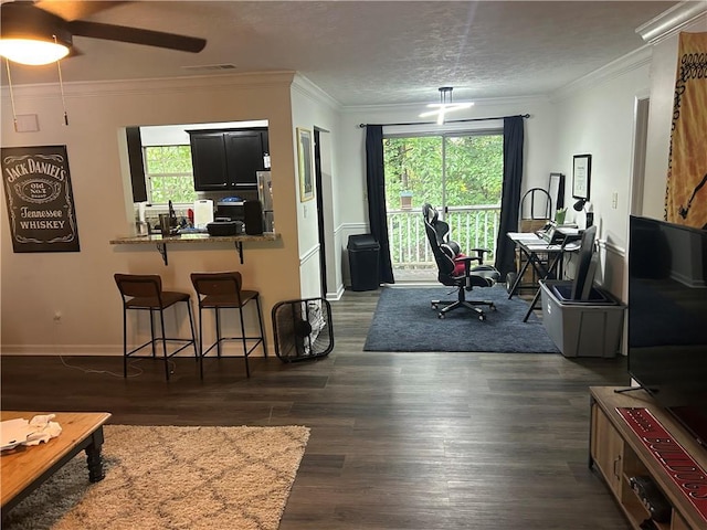 122 Sterling Ct Unit 122, Alpharetta, GA 30004 - living room featuring plenty of natural light, dark wood finished floors, a ceiling fan, and ornamental molding