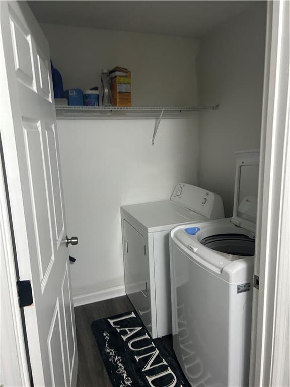 122 Sterling Ct Unit 122, Alpharetta, GA 30004 - laundry area featuring washing machine and dryer and dark wood-type flooring