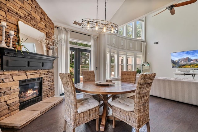 217 Springs Xing, Canton, GA 30114 - dining room featuring hardwood / wood-style floors, a fireplace, french doors, high vaulted ceiling, and a ceiling fan