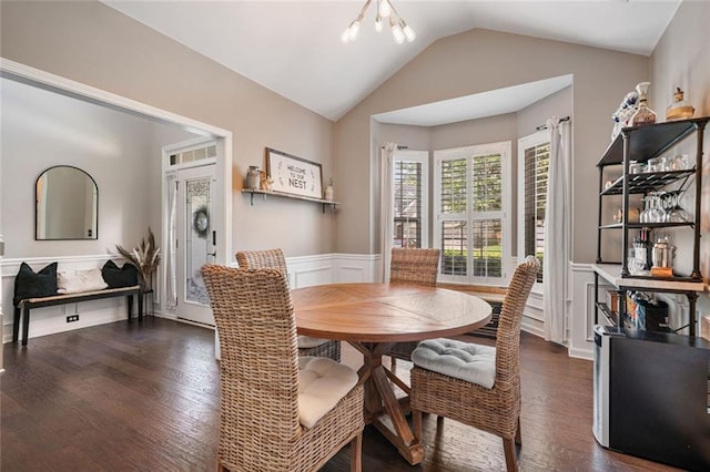 217 Springs Xing, Canton, GA 30114 - dining space featuring dark wood finished floors, lofted ceiling, and wainscoting