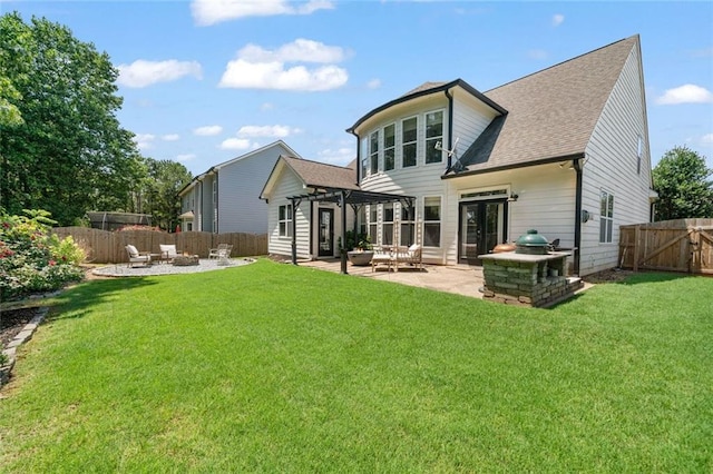 217 Springs Xing, Canton, GA 30114 - back of house with an outdoor fire pit, a patio area, a fenced backyard, and roof with shingles