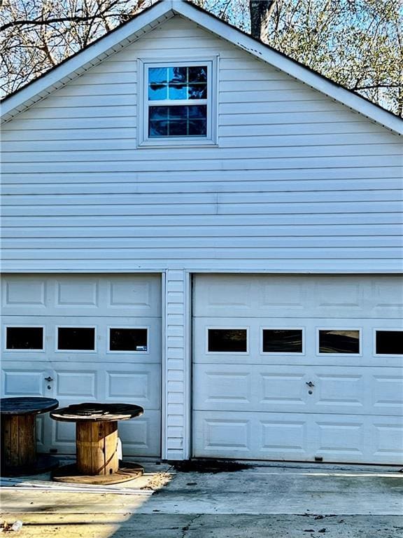 view of home's exterior with an outdoor structure and a garage