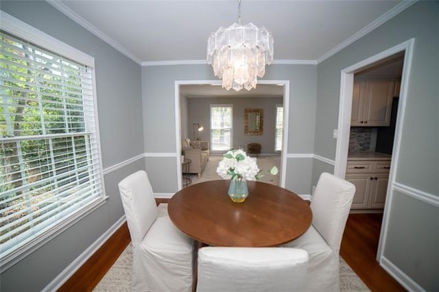 909 NE Otter Way NE, Marietta, GA 30068 - dining space with a chandelier, dark wood-style flooring, and ornamental molding