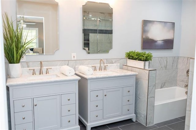 909 NE Otter Way NE, Marietta, GA 30068 - bathroom featuring vanity, tile patterned floors, a bath, tile walls, and a shower stall