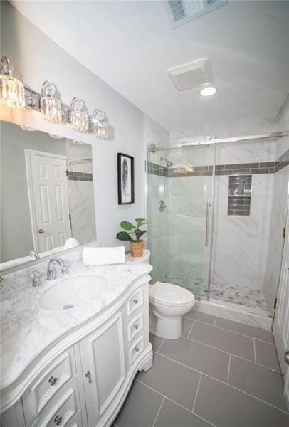 909 NE Otter Way NE, Marietta, GA 30068 - bathroom with vanity, a stall shower, lofted ceiling, and tile patterned floors