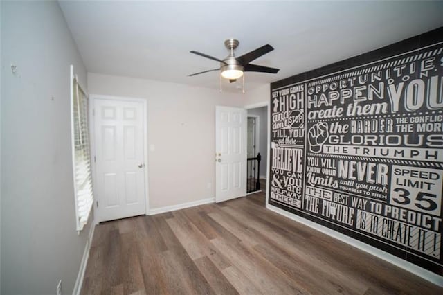 909 NE Otter Way NE, Marietta, GA 30068 - unfurnished bedroom featuring wood finished floors and ceiling fan