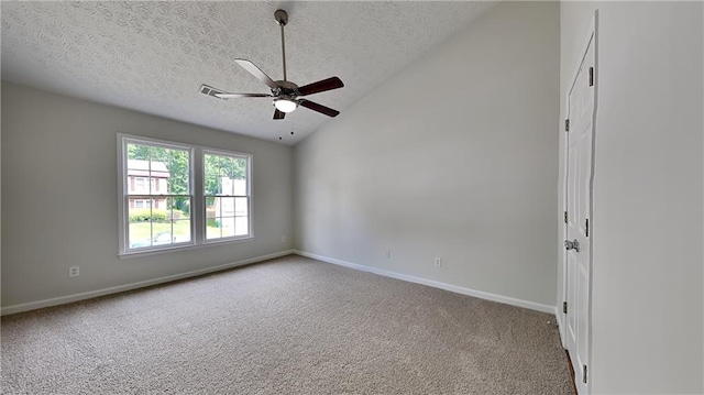 carpeted empty room with lofted ceiling, a textured ceiling, baseboards, and a ceiling fan