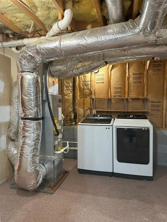 washroom featuring washer and clothes dryer and carpet