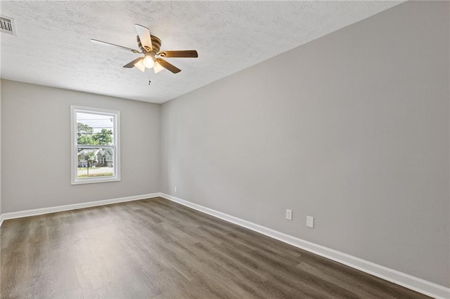 2310 Whitehead Place Dr, Suwanee, GA 30024 - unfurnished room featuring dark wood finished floors, ceiling fan, and a textured ceiling