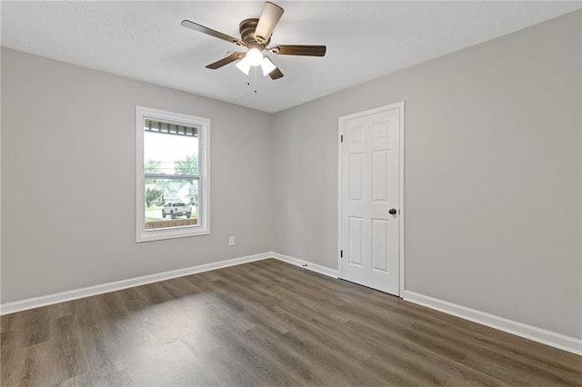2310 Whitehead Place Dr, Suwanee, GA 30024 - unfurnished room with dark wood-type flooring and a ceiling fan