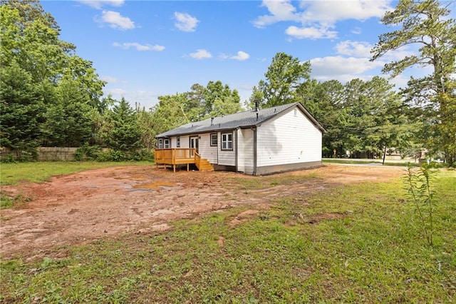 2310 Whitehead Place Dr, Suwanee, GA 30024 - back of property featuring a deck and a lawn
