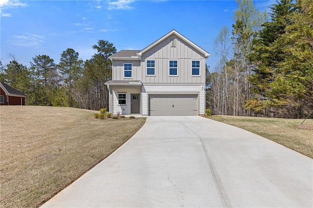 view of front of home with board and batten siding, an attached garage, a front yard, and driveway