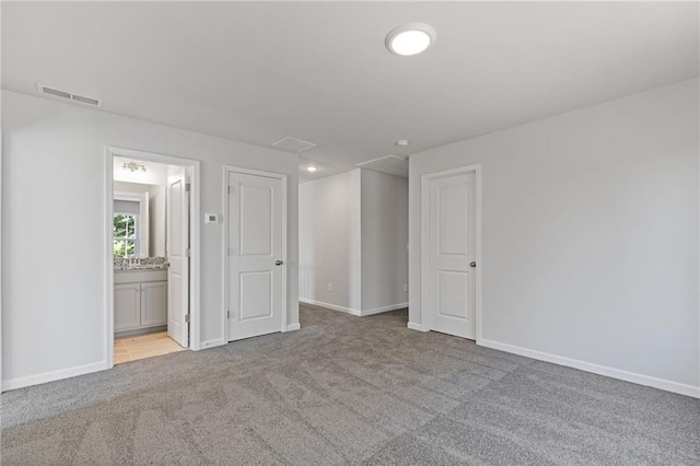 interior space featuring baseboards and visible vents