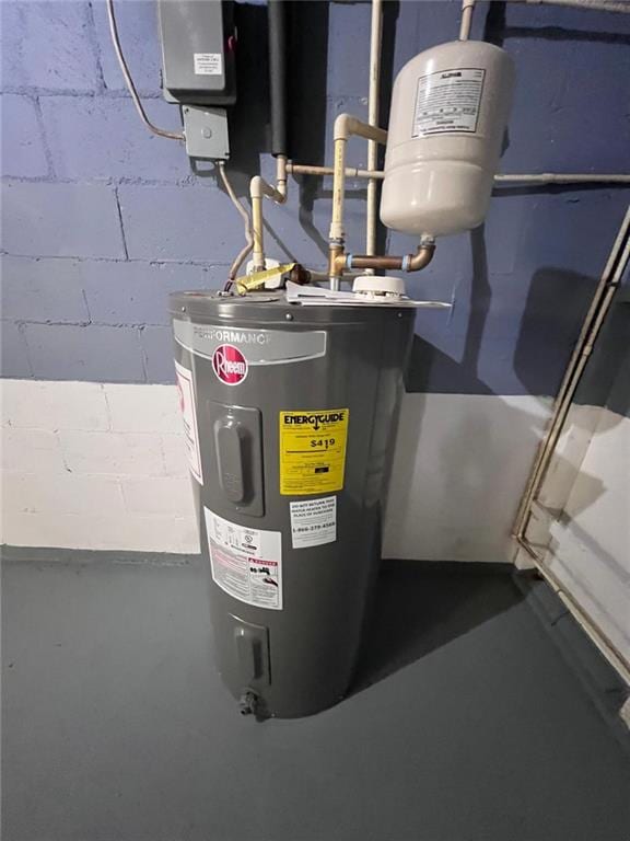 utility room featuring electric water heater