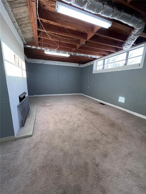 basement with carpet flooring