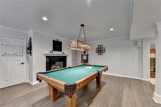 playroom featuring ornamental molding, wood finished floors, and a premium fireplace